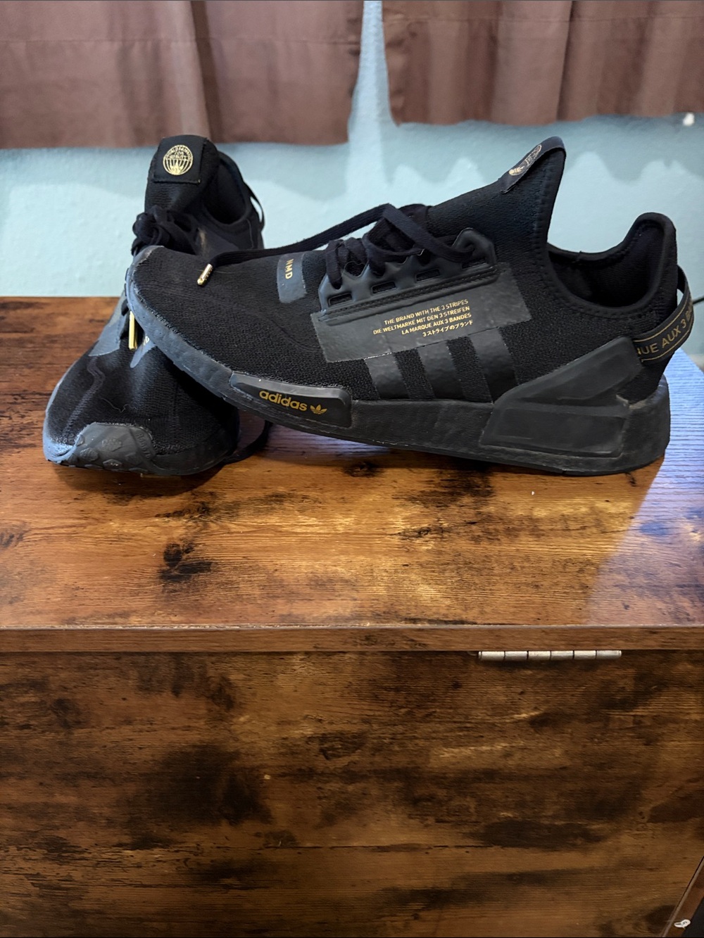 adidas NMD Black Athletic Sneaker with Gold Accents
